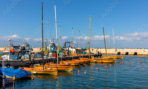 Panoramic view of yacht port and marina at Mediterranean coastline beneath Old City of Jaffa in Tel Aviv Yafo, Israel photo