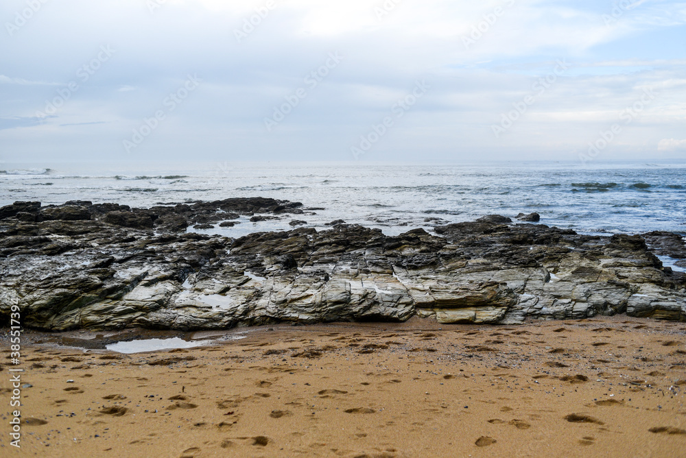 A rocky sandy beach off the coast of France.