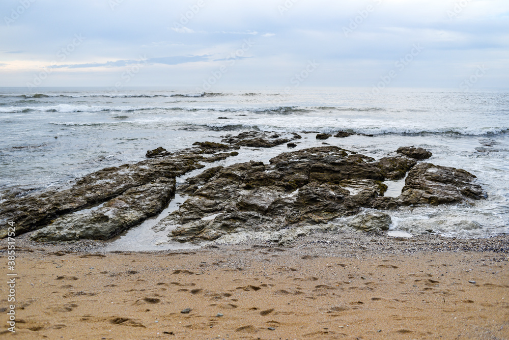 A rocky sandy beach off the coast of France.