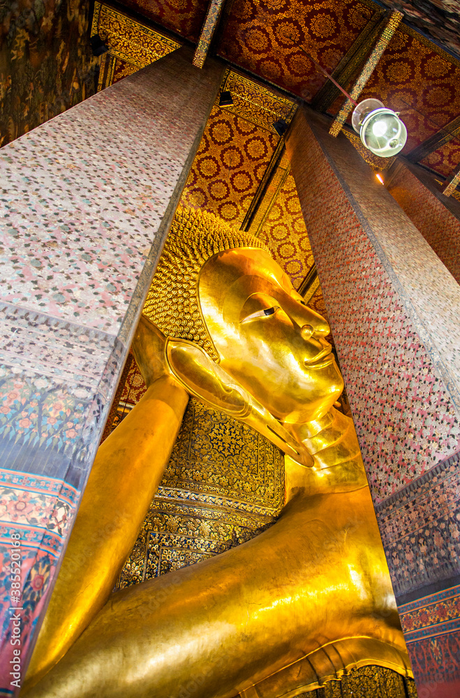 The Big Reclining Buddha statue in Wat Pho Temple, an Asian style Buddha Art, open to worship. Wat Pho is an important temple in Bangkok, Thailand.