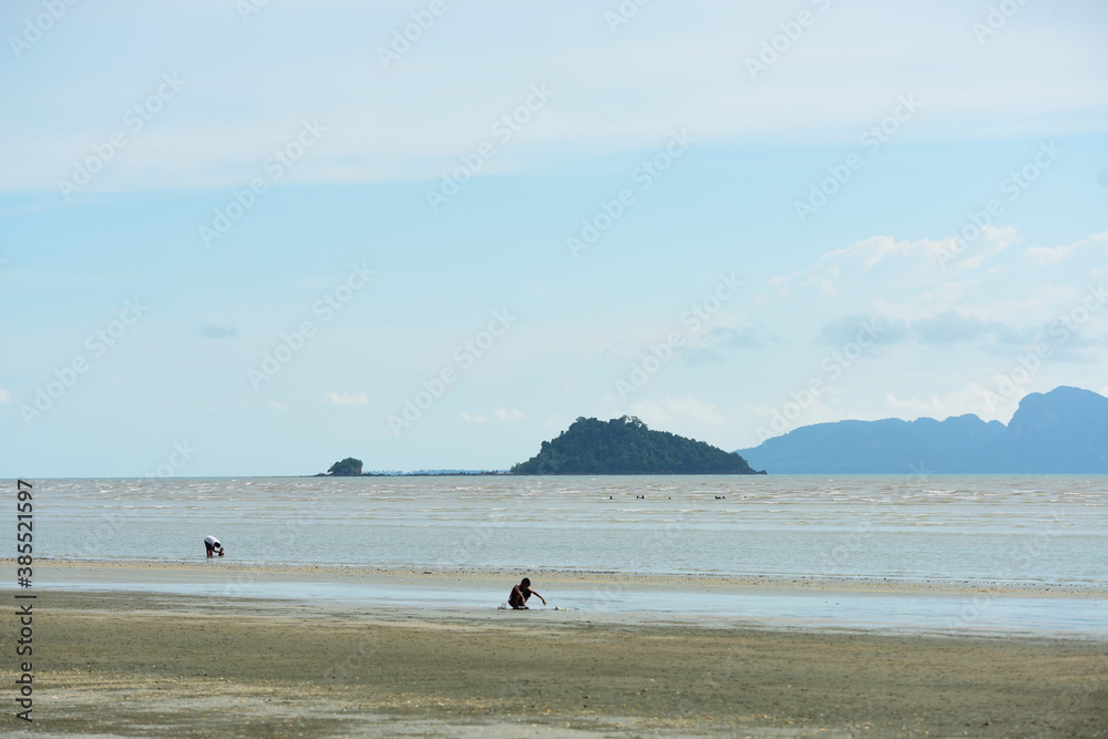 View of the sandy beach and the island on the beach in Trang, Thailand