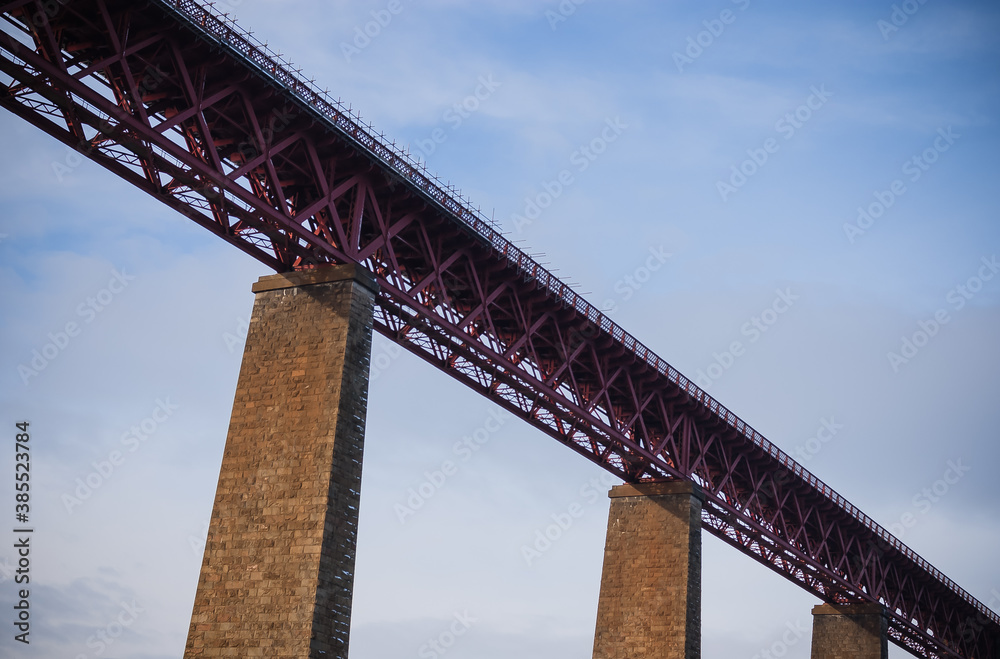 bottom up view of the railway bridge, evening sun, blue sky bottom up view of the railway bridge, evening sun, blue sky