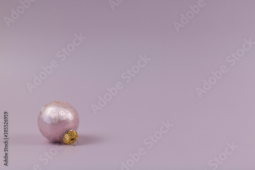 pink christmas background and pink christmas ornament. Monochrome.