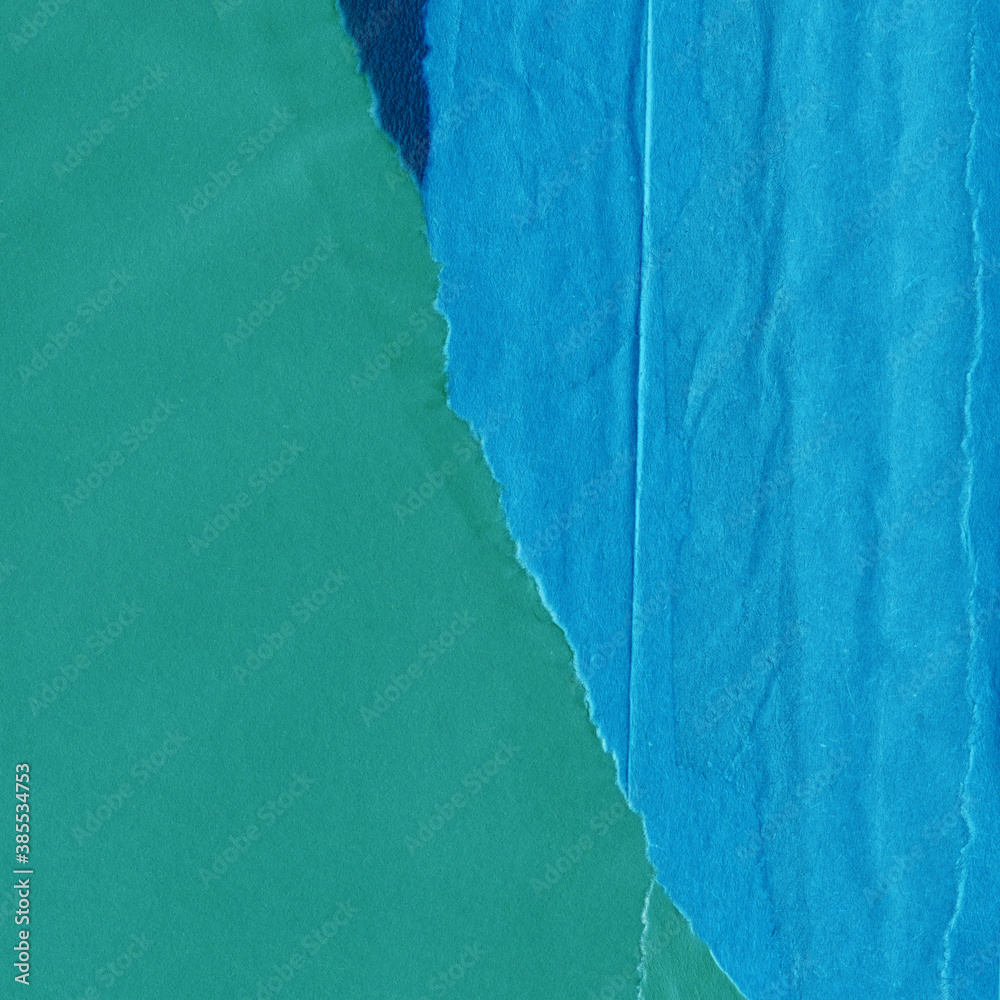Blue torn paper collage close-up. Texture made from various paper and cardboard parts. Damaged old paper background. Vintage blank wallpaper. Material design backdrop. Blue torn paper collage close-up. Texture made from various paper and cardboard parts. Damaged old paper background. Vintage blank wallpaper. Material design backdrop.