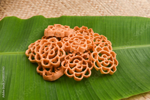 Rose Cookies or Achu Murruku Achappam  achapum, banana leaf rosette cookie Anglo Indian cookie Indian Christians christmas, rice flour,   Kerala South India Traditional Malaysian, Indonesian Brunei  photo