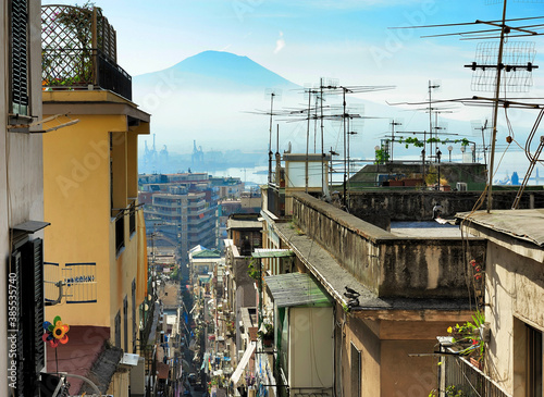 Vesuvius and alley among the crowded neighborhoods of Naples, Italy