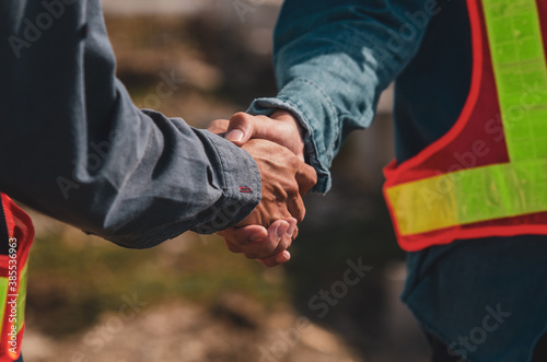 Shake hand concept, Engineer hands shake at work place building construction estate for project success