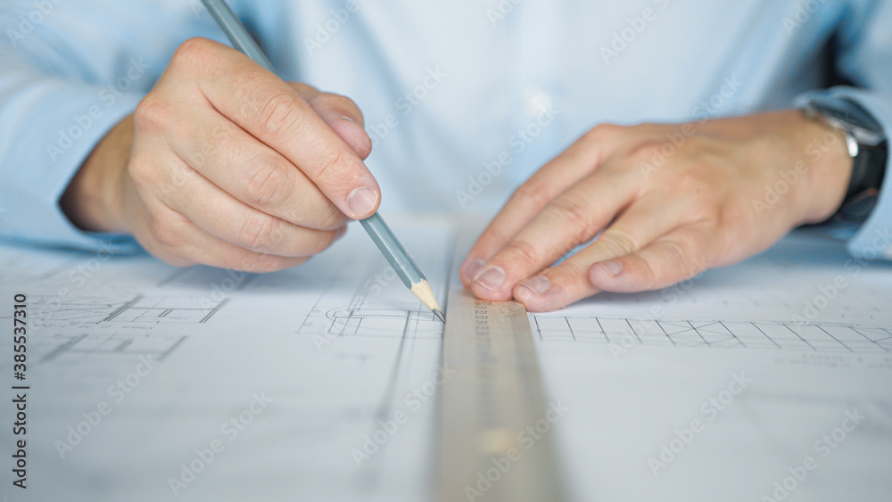 Designer's hands making a drawing Designer's hands making a drawing
