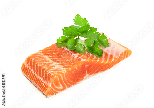 Piece of fresh salmon fillet sliced with coriander leaves isolated on white background