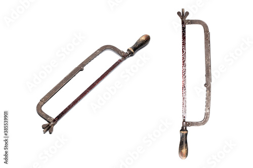 Rusty saw with blood isolated on white background. Halloween horror, maniac work tool concept. 
