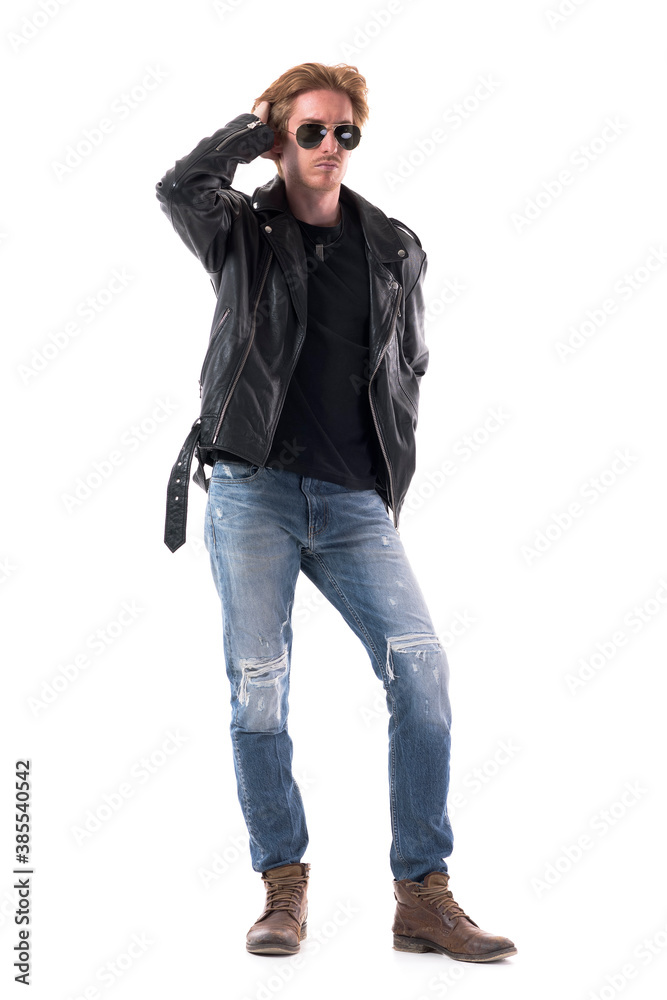 Fashionable macho redhead man posing with hand in hair adjusting hairstyle. Full body isolated on white background. Fashionable macho redhead man posing with hand in hair adjusting hairstyle. Full body isolated on white background.