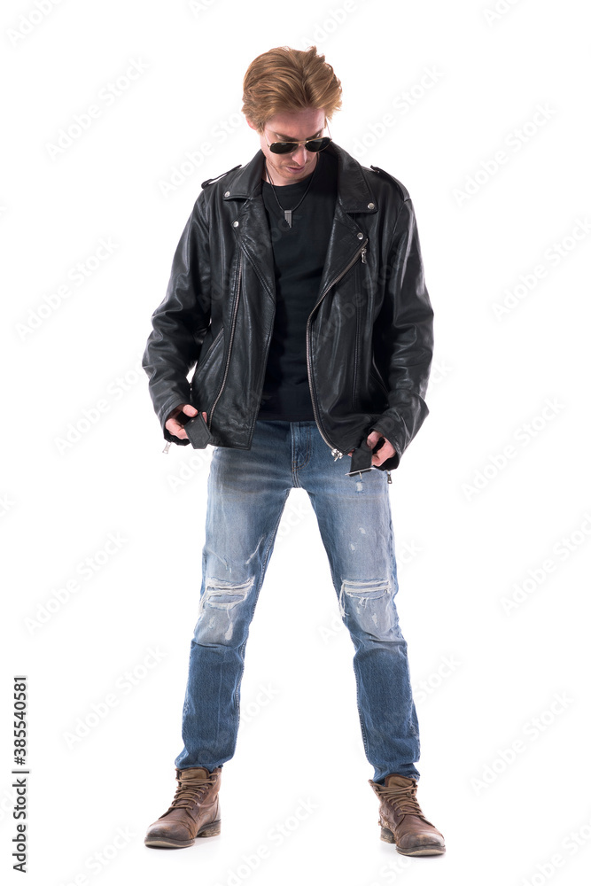 Stylish biker or rock subculture man put on leather jacket getting dressed. Full body isolated on white background. Stylish biker or rock subculture man put on leather jacket getting dressed. Full body isolated on white background.