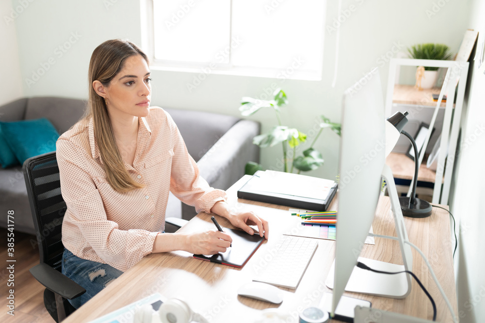 Busy designer working in her office Busy designer working in her office