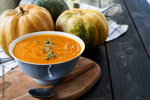 Homemade pumpkin soup on a black table