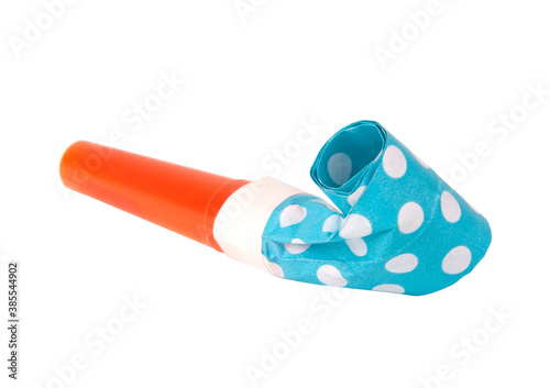 Rolled festive noisemaker or party whistle horn on the white isolated