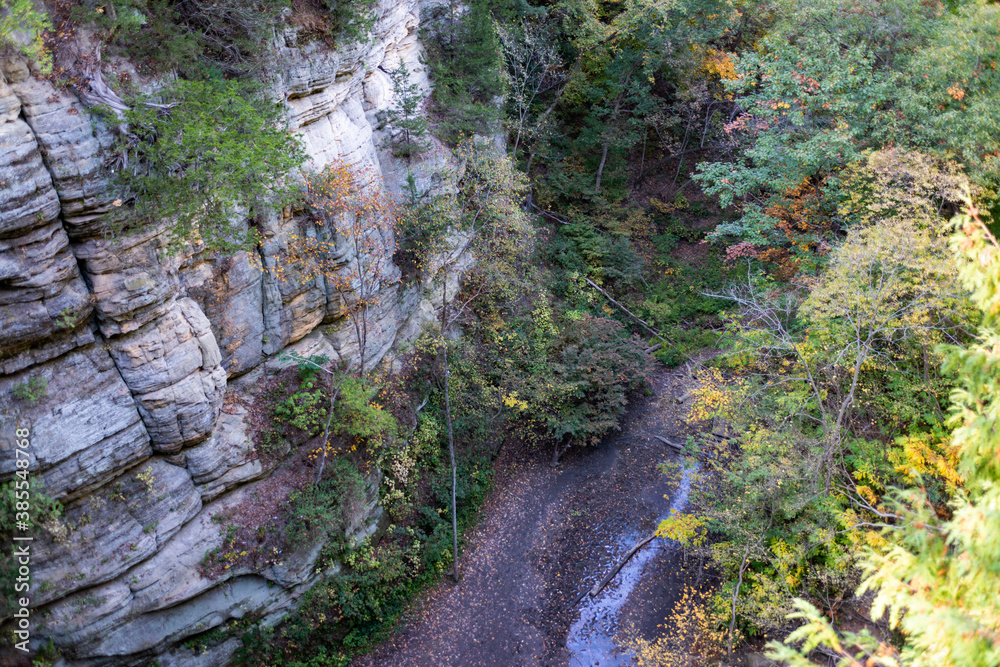 Autumn in Starved Rock State Park, a wilderness area on the Illinois River in the U.S. state of Illinois. Steep sandstone canyons formed by glacial meltwater. Utica. Autumn in Starved Rock State Park, a wilderness area on the Illinois River in the U.S. state of Illinois. Steep sandstone canyons formed by glacial meltwater. Utica.
