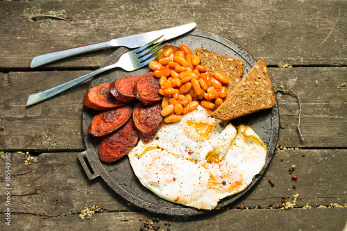 Traditional Full English Breakfast with Eggs, Bacon, Sausage photo