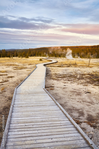 Wooden bridge in Yellowstone National Park at sunset, Wyoming, USA. © MaciejBledowski