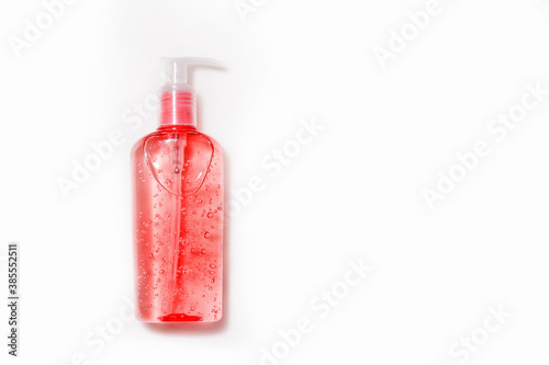 Mock up liquid gel, soap, shampoo. Pink bottle with dispenser on white background