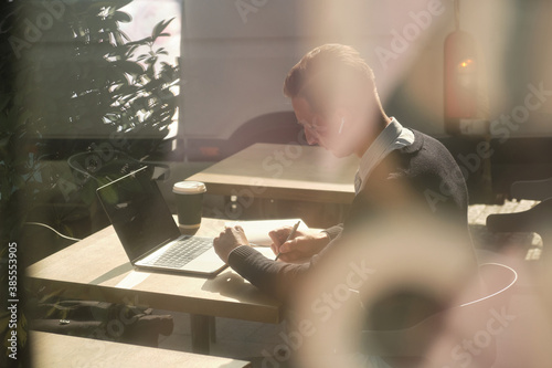 Handsome busyness man coffee time at sunny day in office district