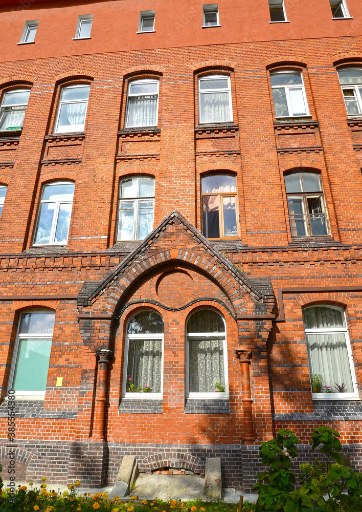 Fototapeta premium Portal on the facade of the brick building of the former Lebenikht hospital (1903). Kaliningrad