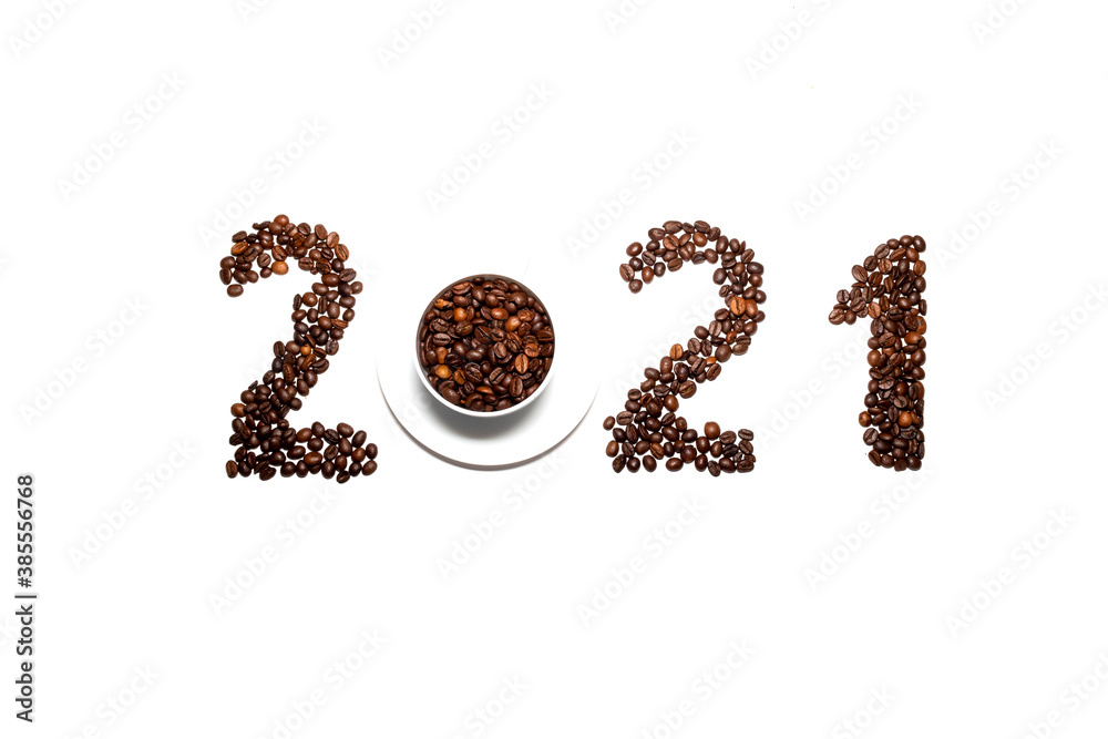 2021 laid out from coffee beans on a white background. christmas coffee house concept 2021 laid out from coffee beans on a white background. christmas coffee house concept