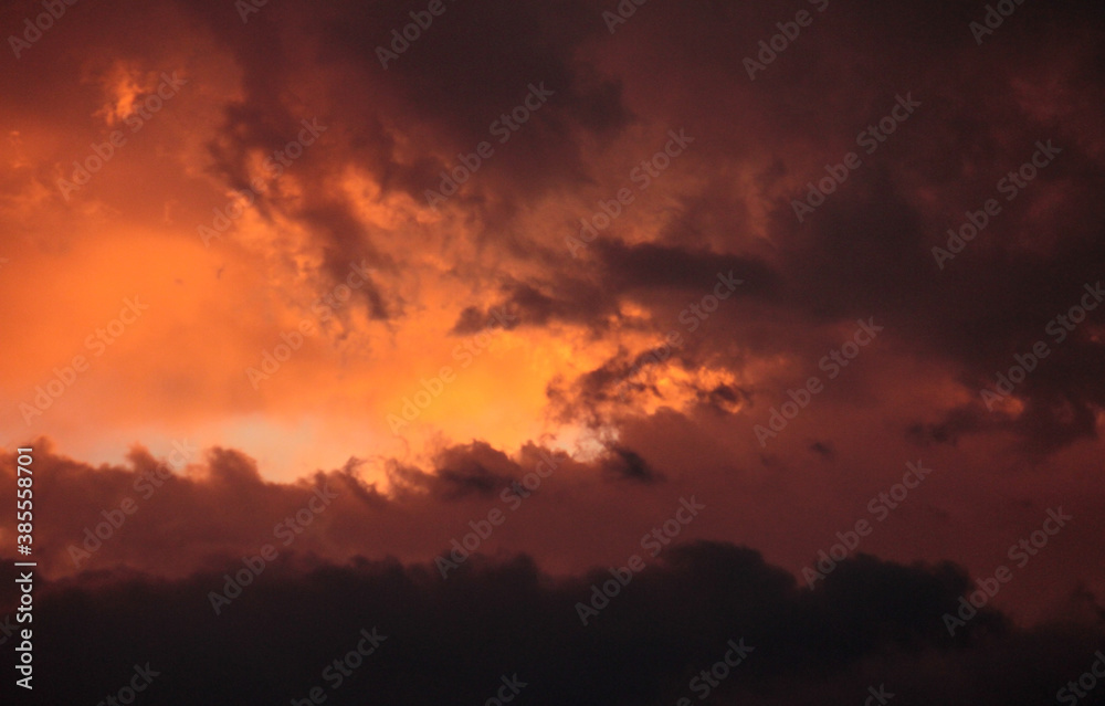 Cloudscape. Dramatic sunset sky and clouds with beautiful red, black, yellow and orange colors.