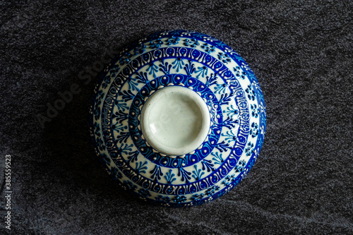 Handmade Ceramic Bowls and Cups Handcrafted with Traditional Ottoman Pattern on Dark Surface and Backround / Handicraft.