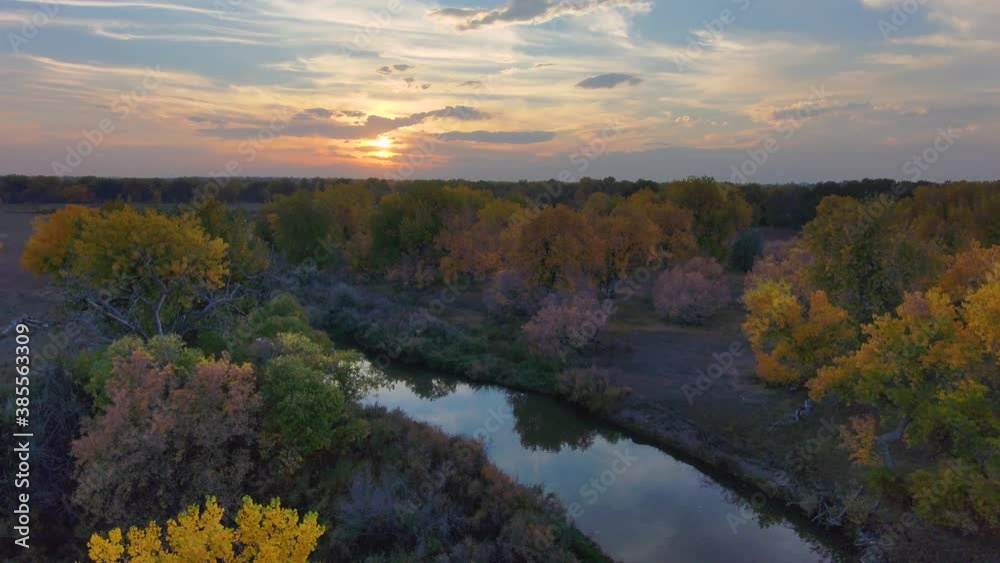 Veneers of color lay atop one another in the fall season in Northern Colorado. A sunset with colors that mimic the foliage in gold and amber. Veneers of color lay atop one another in the fall season in Northern Colorado. A sunset with colors that mimic the foliage in gold and amber.