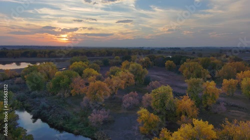 Wallpaper Mural Autumn hues of amber and gold blend into the vivid sunset along the Platte river in Northern Colorado. Torontodigital.ca