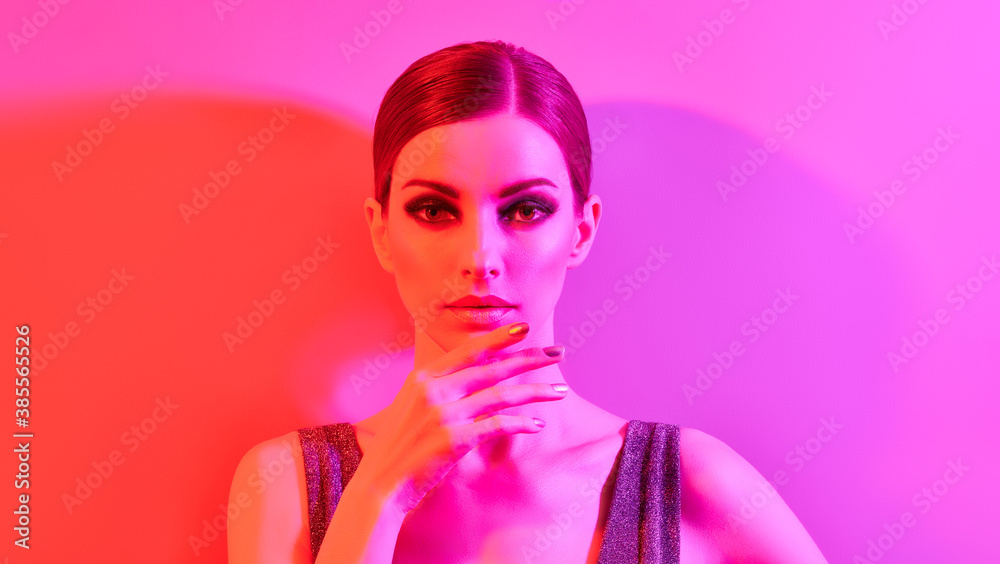 Woman in colorful neon light, make-up. Sexy Fashion girl, stylish hair, trendy makeup. Party disco neon style. Creative art beauty portrait, fashionable model, bright make up Woman in colorful neon light, make-up. Sexy Fashion girl, stylish hair, trendy makeup. Party disco neon style. Creative art beauty portrait, fashionable model, bright make up