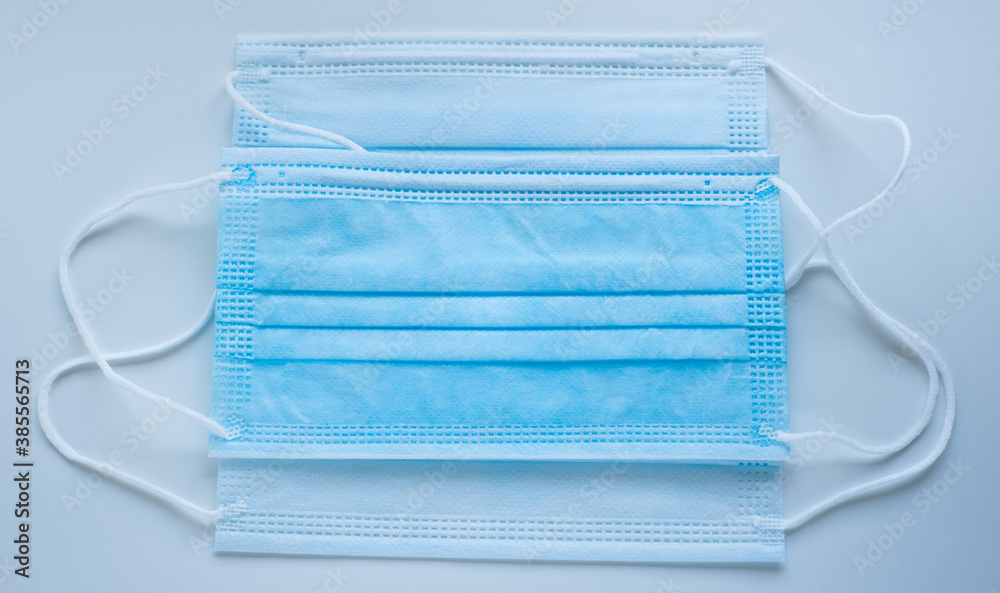 Medical protective mask on a blue background Medical protective mask on a blue background