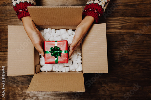 Slika na platnu Concept of receiving or shipping Christmas parcel at home