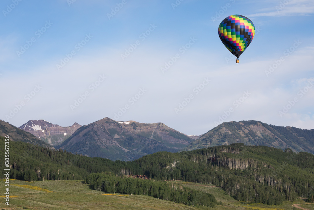Fototapeta premium Hot Air Balloon over Mountains
