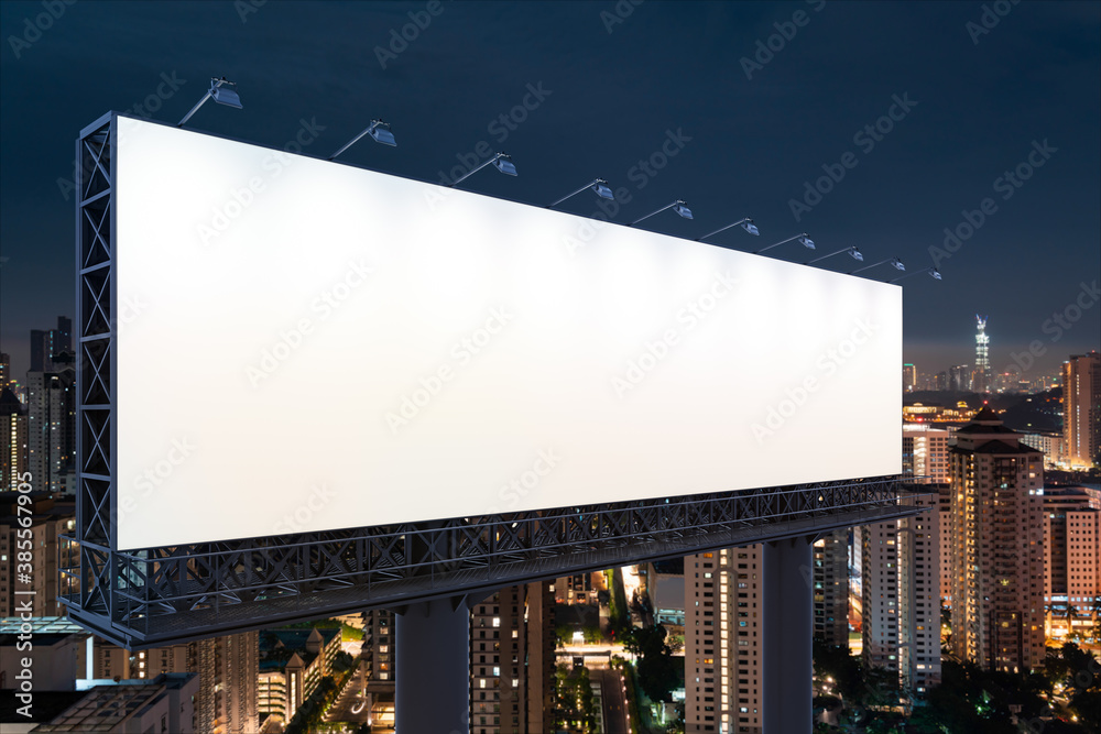 Blank white road billboard with KL cityscape background at night time. Street advertising poster, mock up, 3D rendering. Side view. The concept of marketing communication to promote or sell idea. Blank white road billboard with KL cityscape background at night time. Street advertising poster, mock up, 3D rendering. Side view. The concept of marketing communication to promote or sell idea.