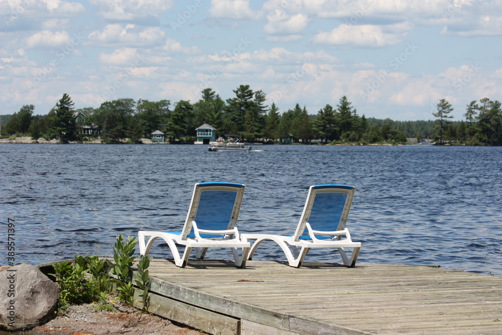 empty chairs by the lake