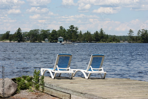 empty chairs by the lake © Heidi