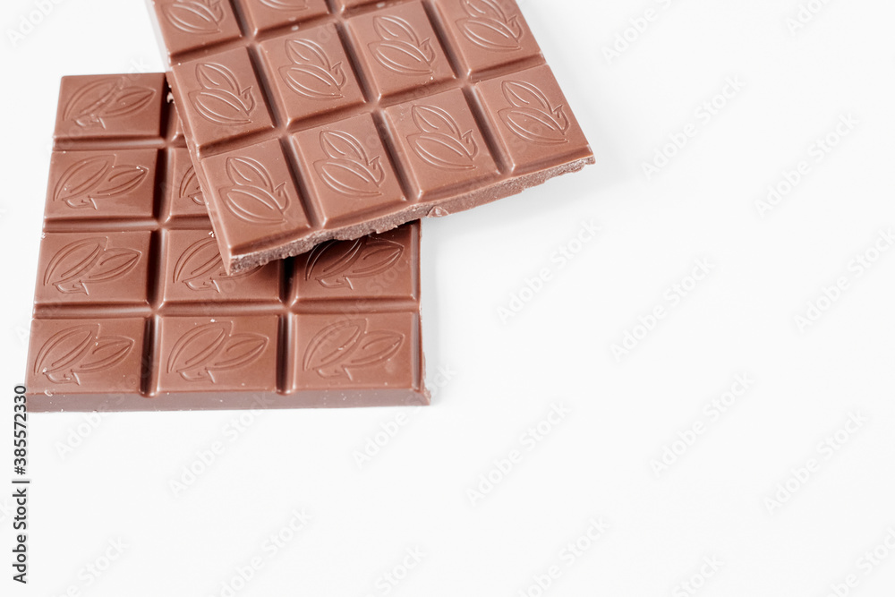 close up a chocolate bar isolated on white background close up a chocolate bar isolated on white background