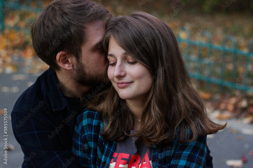 Couple kissing. Portrait of couple. Couple in love. Man and woman at the street. Couple are hugging. Couple kissing. Portrait of couple. Couple in love. Man and woman at the street. Couple are hugging.