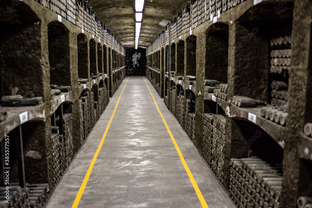 old bottles with wine stored in special cellars and stored using special technology