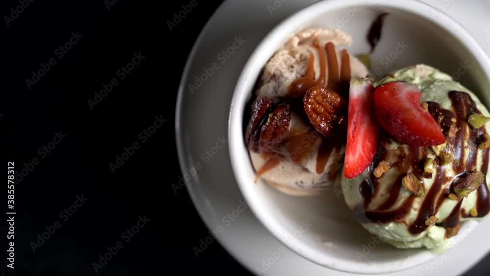 Ice Cream Dessert dish spinning on black background 4k Ice Cream Dessert dish spinning on black background 4k
