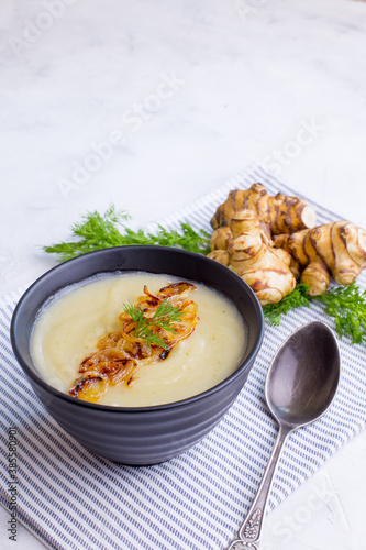 Cream of Jerusalem artichoke soup. Vegetarian dish of Jerusalem artichoke tubers.