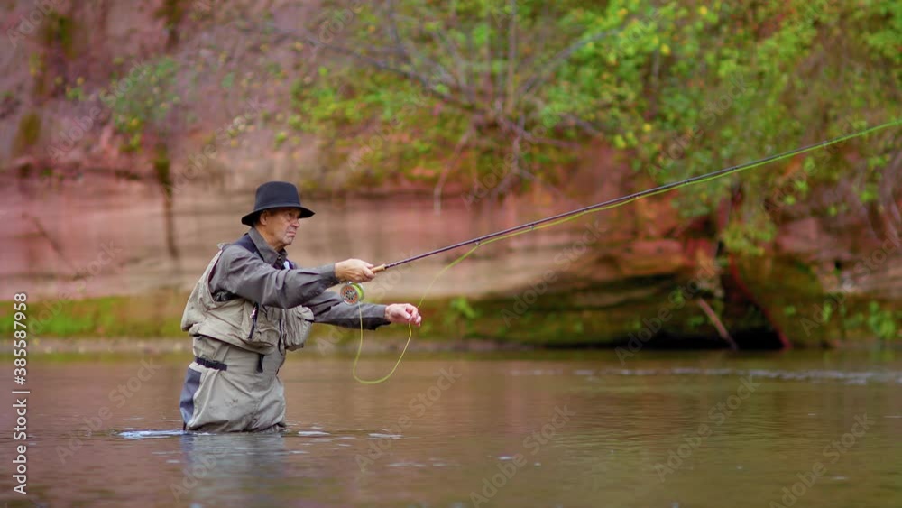 A fully equipped fisherman swinging the fishing line to cast salmon
A man in waterproof clothing and a hat stands in a river and casts his lure with his rod. A fully equipped fisherman swinging the fishing line to cast salmon
A man in waterproof clothing and a hat stands in a river and casts his lure with his rod.