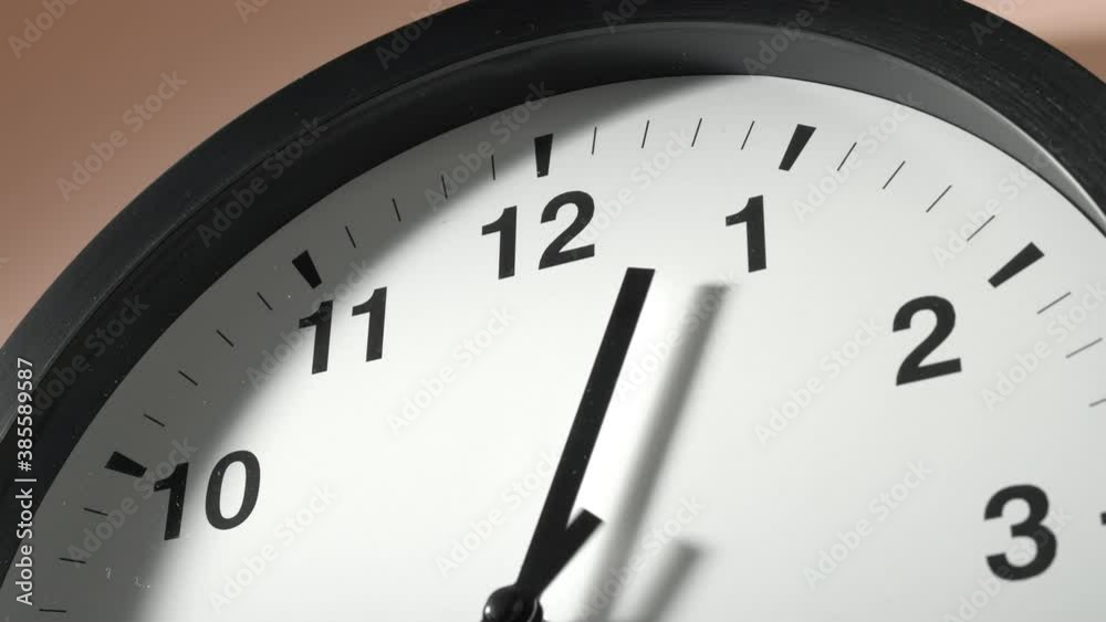 Clock Face in Time Lapse on Cream Beige Wall in Office Clock Face in Time Lapse on Cream Beige Wall in Office