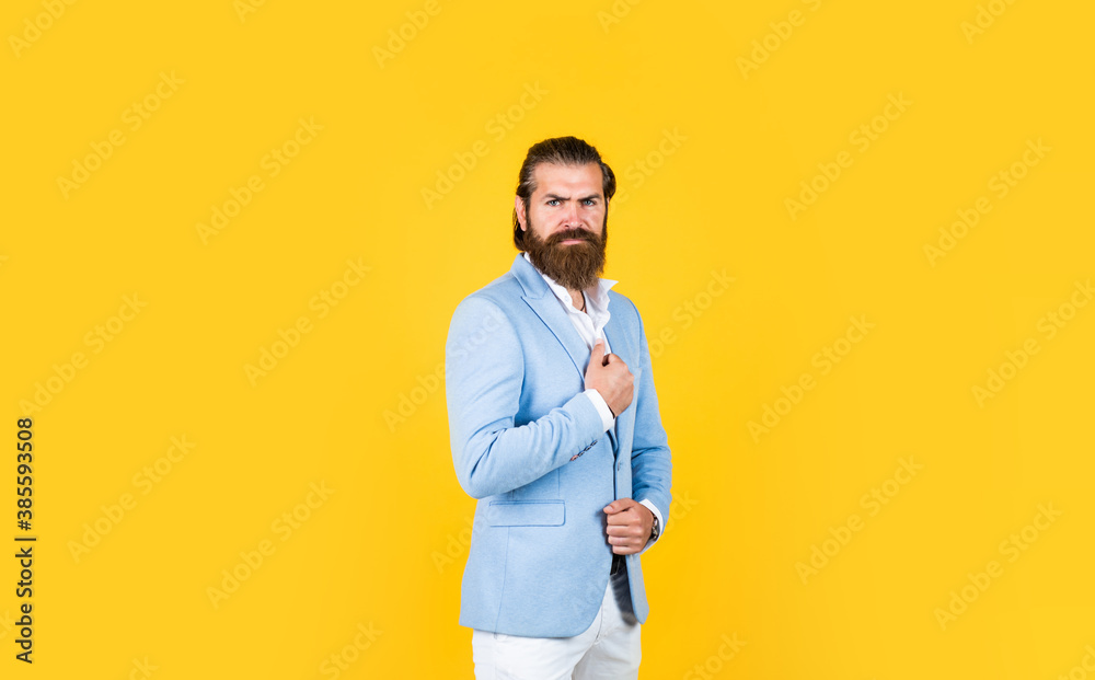 Fashion portrait of man. confident businessman has trendy hairstyle. male with beard having formal look. male beauty and fashion. handsome man with moustache. bearded mature hipster wear jacket
