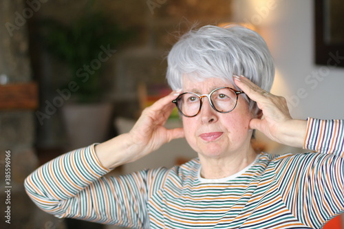 Senior woman experimenting a headache 
