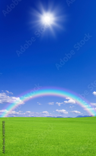 草原と虹と太陽