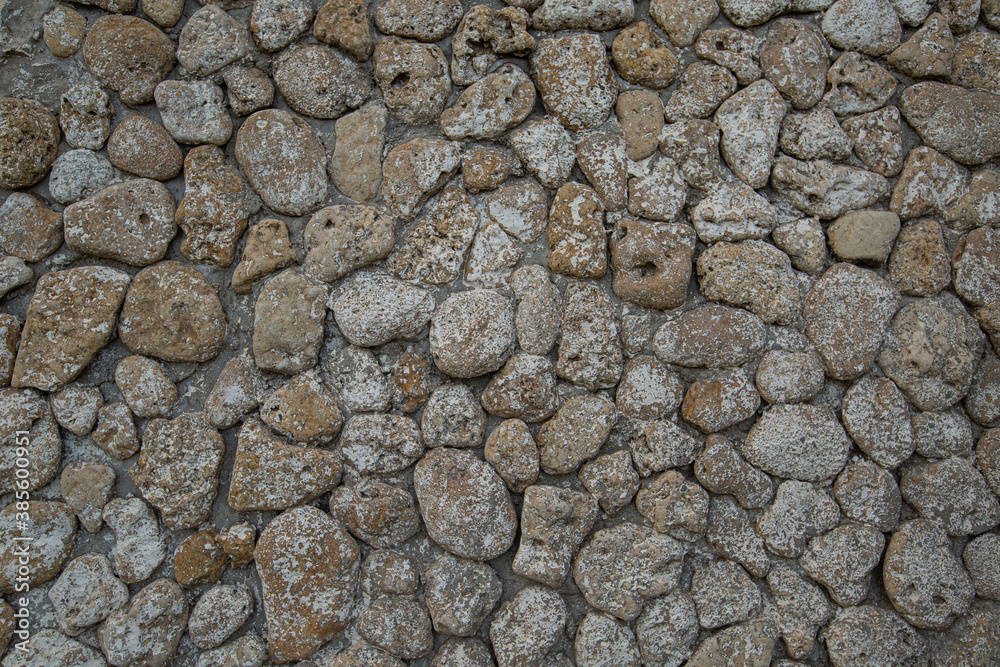 gray stone wall background,
rounded beige stones gray stone wall background,
rounded beige stones