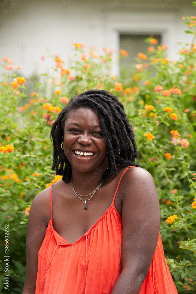 Portrait smiling plus size Black woman with locs Portrait smiling plus size Black woman with locs