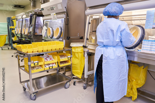 Black healthcare worker handling hazardous drugs for patient at hospital